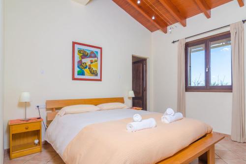 a bedroom with two beds with towels on them at S'Alqueria in Campanet