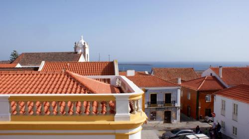 a view of a city with red roofs at Ana's Apartments in Sines