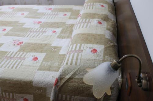 a close up of a bed with a quilt at Casa Marilì in Pianillo