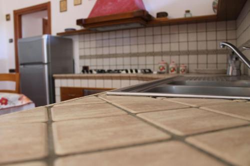 a kitchen with a sink and a counter top at Casa Marilì in Pianillo