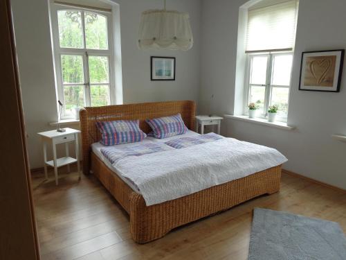 Postel nebo postele na pokoji v ubytování Ferienwohnung Sonne im Gästehaus Heeren