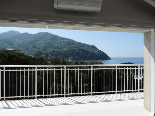 a view of the ocean from the balcony of a house at Penthouse by the Sea in Levanto