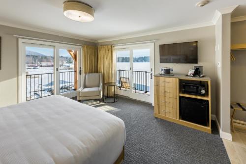 A bed or beds in a room at Center Harbor Inn