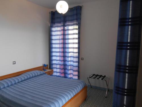 Postel nebo postele na pokoji v ubytování Albergo Villa Verde