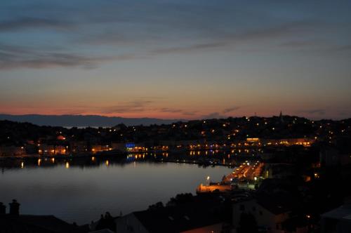 a view of a lake at night at Design apartments 3&4 in Mali Lošinj