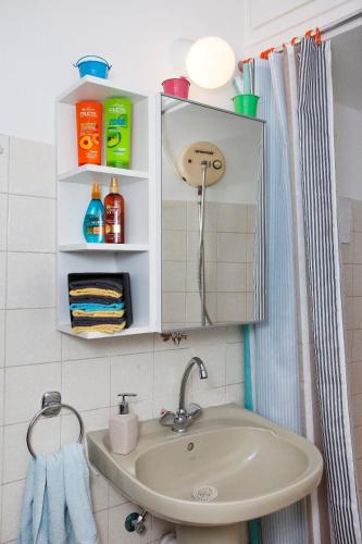 a bathroom with a sink and a shower at Artemis Boutique Apartment 1 in Limassol