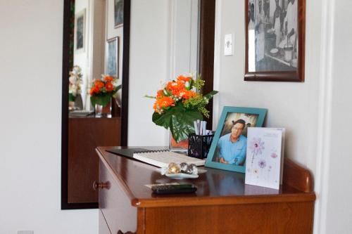 a desk with a laptop and a picture on it at Artemis Boutique Apartment 1 in Limassol