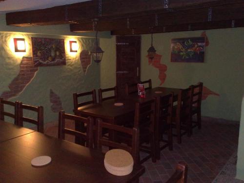 a dining room with tables and chairs in a restaurant at Ubytovani U Kulky in Kyjov