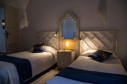 Ένα ή περισσότερα κρεβάτια σε δωμάτιο στο Casa Serene