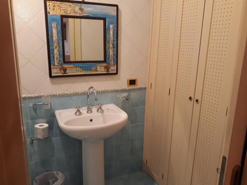 a bathroom with a sink and a mirror at CETARA - ALBERGO DIFFUSO in Cetara