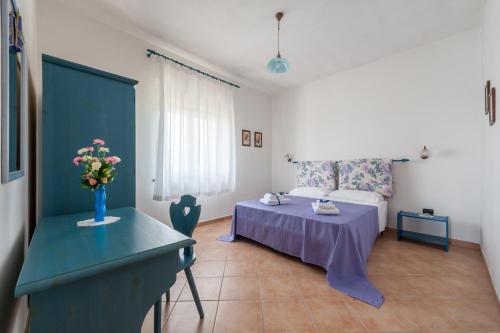 Ένα ή περισσότερα κρεβάτια σε δωμάτιο στο La Torretta di Casa Lippi
