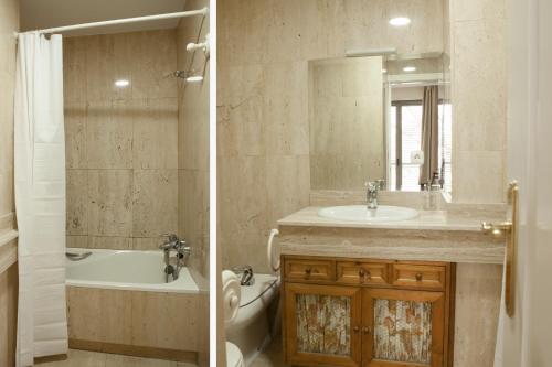 a bathroom with a tub and a sink and a bath tub at Piso en el Centro Plaza de España in Seville