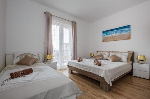 Postel nebo postele na pokoji v ubytování Villa Nora