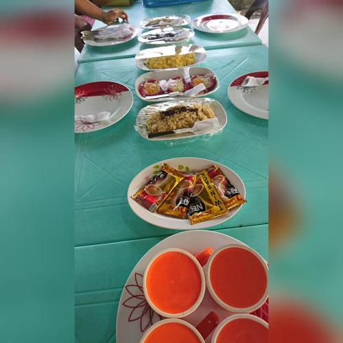 a table with plates of food on it at Prince Transient house in San Jose