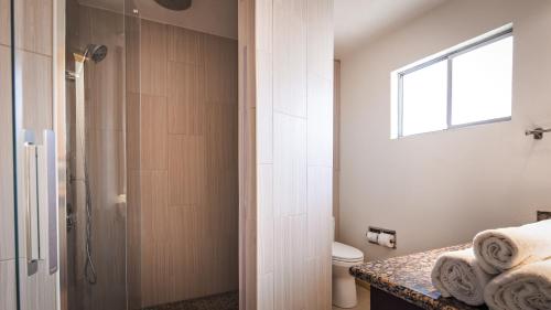 a bathroom with a shower and a toilet at Best Western Inn in Merced