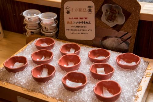 a group of bowls of food on a table at Takamiya Bettei Kuon in Tsuruoka