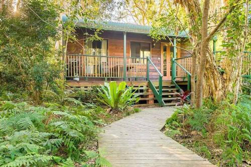 a house with a walkway in front of it at Wanderers Retreat in Nelson Bay