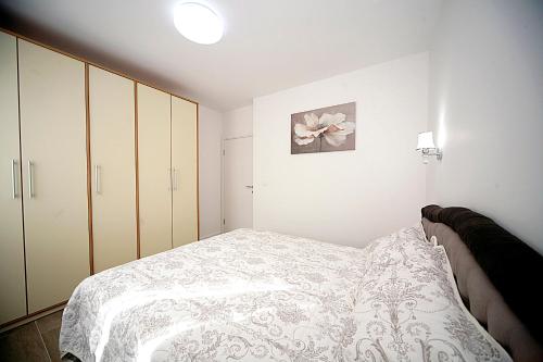 Postel nebo postele na pokoji v ubytování Sea Star Apartment