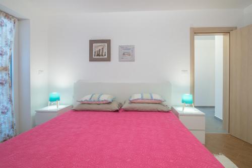 Postel nebo postele na pokoji v ubytování Villa Alice App2