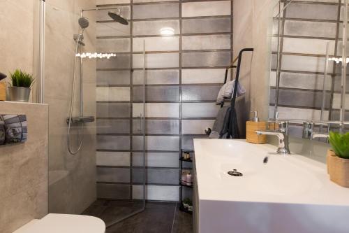 a bathroom with a sink and a shower at Apartmani Violic in Punat