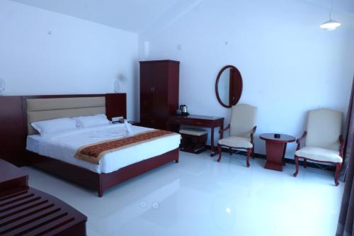 Postel nebo postele na pokoji v ubytování Hotel Aradhana Inn