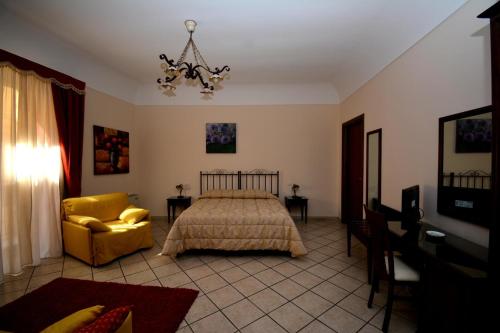 A bed or beds in a room at Affittacamere La Piazzetta