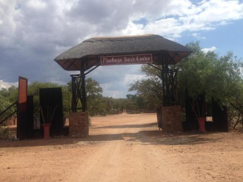 a sign that says traveler load load on a dirt road at Phokoje Bush Lodge in Selebi-Pikwe