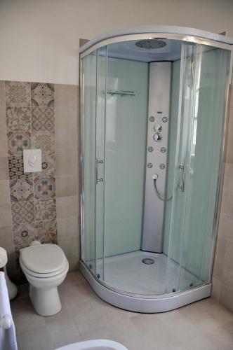 a bathroom with a shower and a toilet at Antica Villa di Bruto in Tivoli