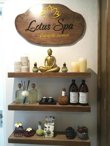 a shelf with a sign that reads leiths spa loyalty the moment at Hanoi Dalvostro Valentino Hotel & Spa in Hanoi