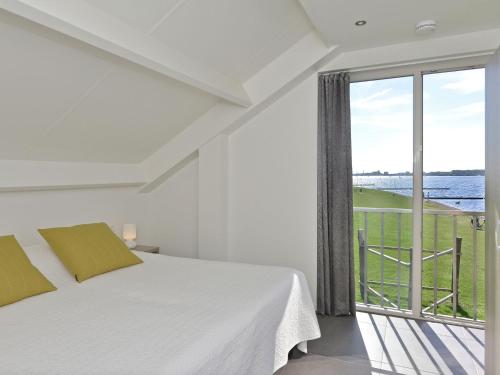 En eller flere senge i et værelse på Modern Escape by the Marina