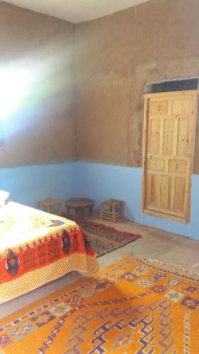 Cama o camas de una habitación en Camping Les Palmeraies