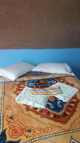 Cama o camas de una habitación en Camping Les Palmeraies