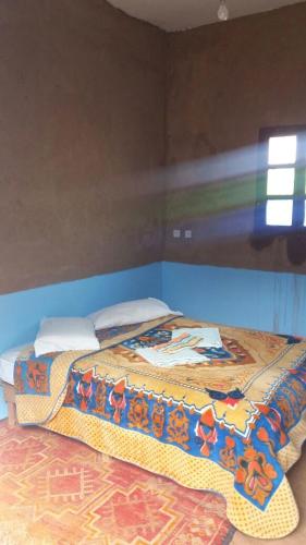 Cama o camas de una habitación en Camping Les Palmeraies