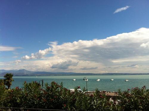 a view of a large body of water with boats in it at Hotel Clodia - Adults Only in Sirmione