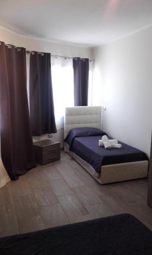 Una cama o camas en una habitación de Samanà B&B con Spiaggia Privata a Punta Prosciutto
