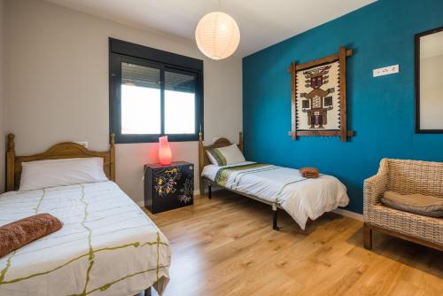 Säng eller sängar i ett rum på Villa Manzanilla, Malaga