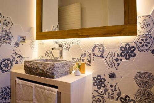 a bathroom with a sink and a mirror at Ca' Baetti l'Antica Corte in Roncola