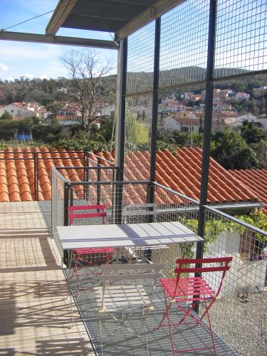 a patio with a table and chairs and a fence at bouchonnerie à Maureillas, near Spain + Mediterranée in Maureillas