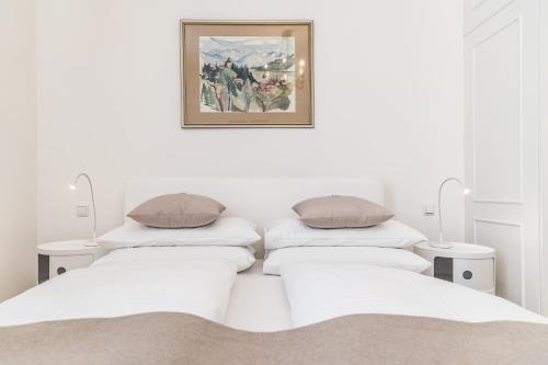 Sandwirth Suites Palais Musilにあるベッド