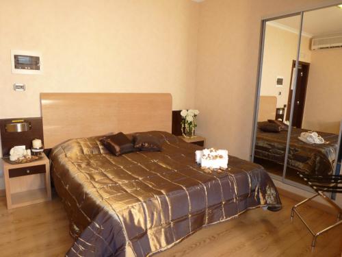 a bedroom with a bed and a large mirror at EH Rome Airport Euro House Hotels in Fiumicino
