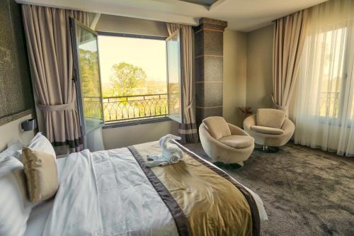 Postel nebo postele na pokoji v ubytování Amazona Hotel