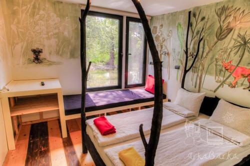a room with a bed and a window at ArkaBarka 2- Floating Dream Rooms and Apartments in Belgrade