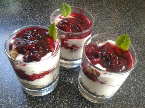 three glasses of dessert with berries and ice cream at Wild Air Guest House in Mevagissey