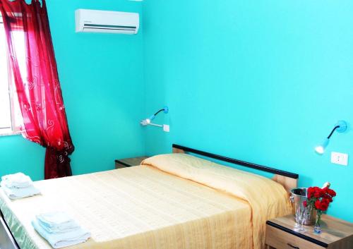 Una cama o camas en una habitación de A Turri Rooms and Restaurant