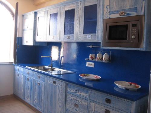 Kitchen o kitchenette sa Residenze confort Isola Rossa
