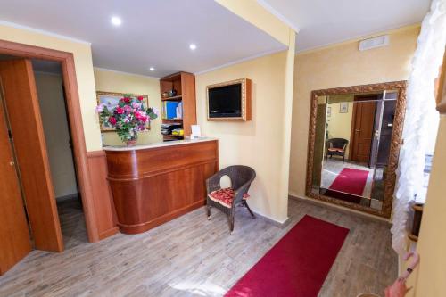 Télévision ou salle de divertissement dans l'établissement Monti Guest House - Affittacamere