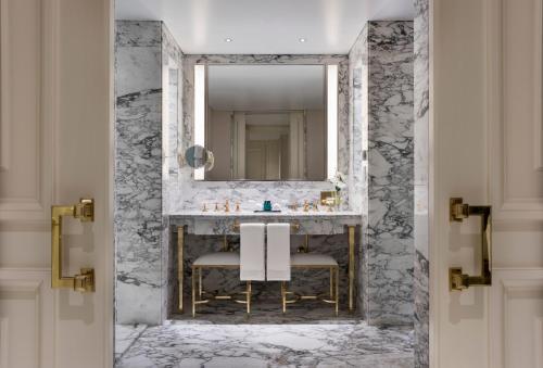 a bathroom with a sink and a mirror at Alvear Icon Hotel in Buenos Aires