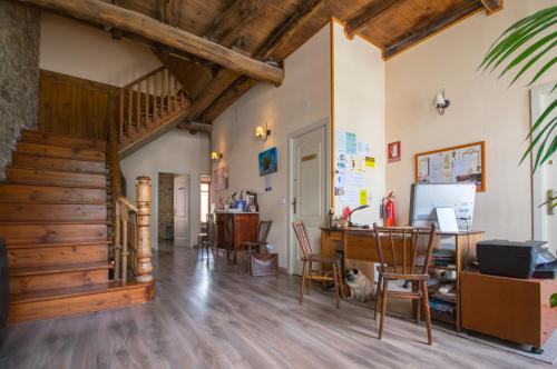 a living room filled with furniture and a wooden floor at La Casona de Sarria in Sarria