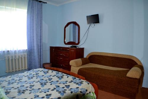 A bed or beds in a room at Karpatski Prostory