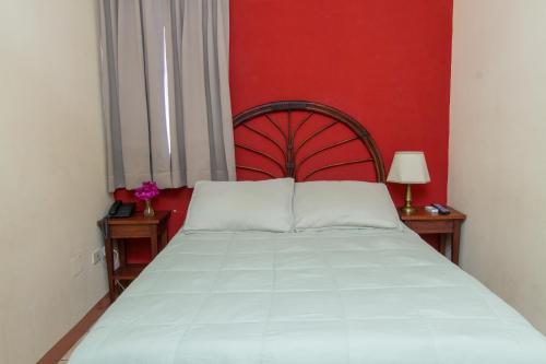 Una cama o camas en una habitación de Hotel Colibri